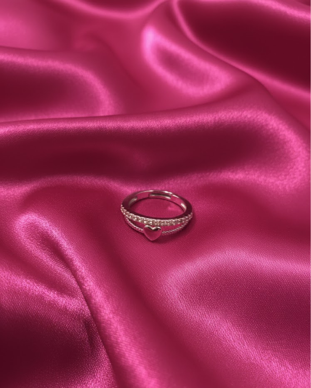 silver-plated adjustable ring with a heart charm and cubic zirconia stones