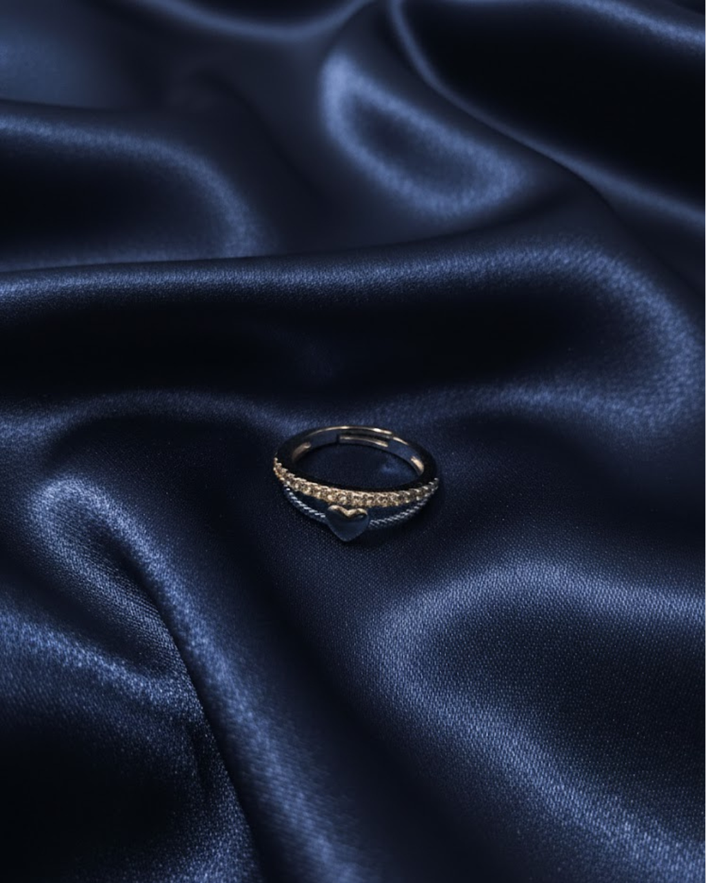 silver-plated adjustable ring with a heart charm and cubic zirconia stones