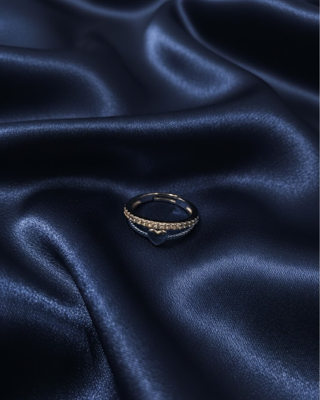 silver-plated adjustable ring with a heart charm and cubic zirconia stones