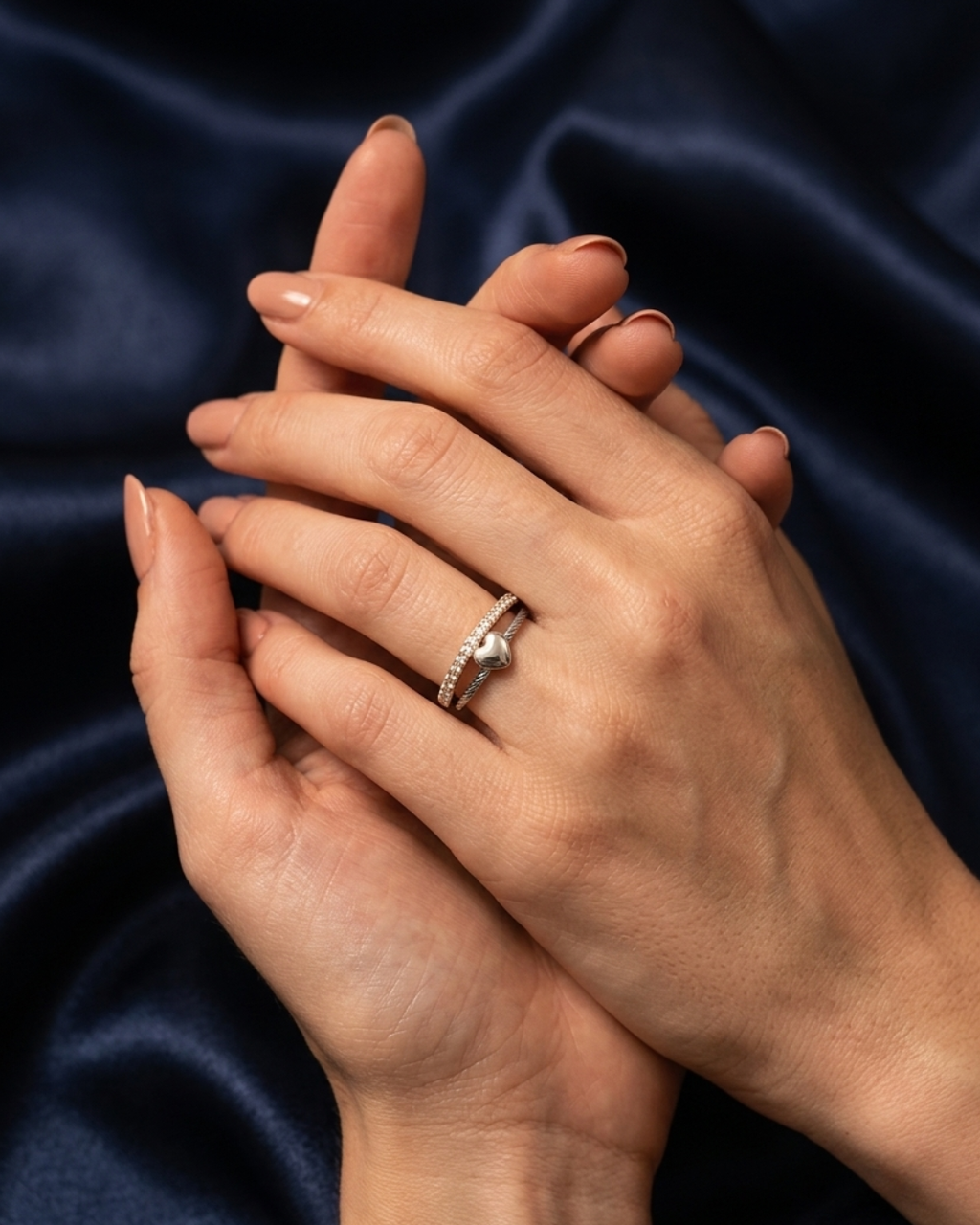silver-plated adjustable ring with a heart charm and cubic zirconia stones