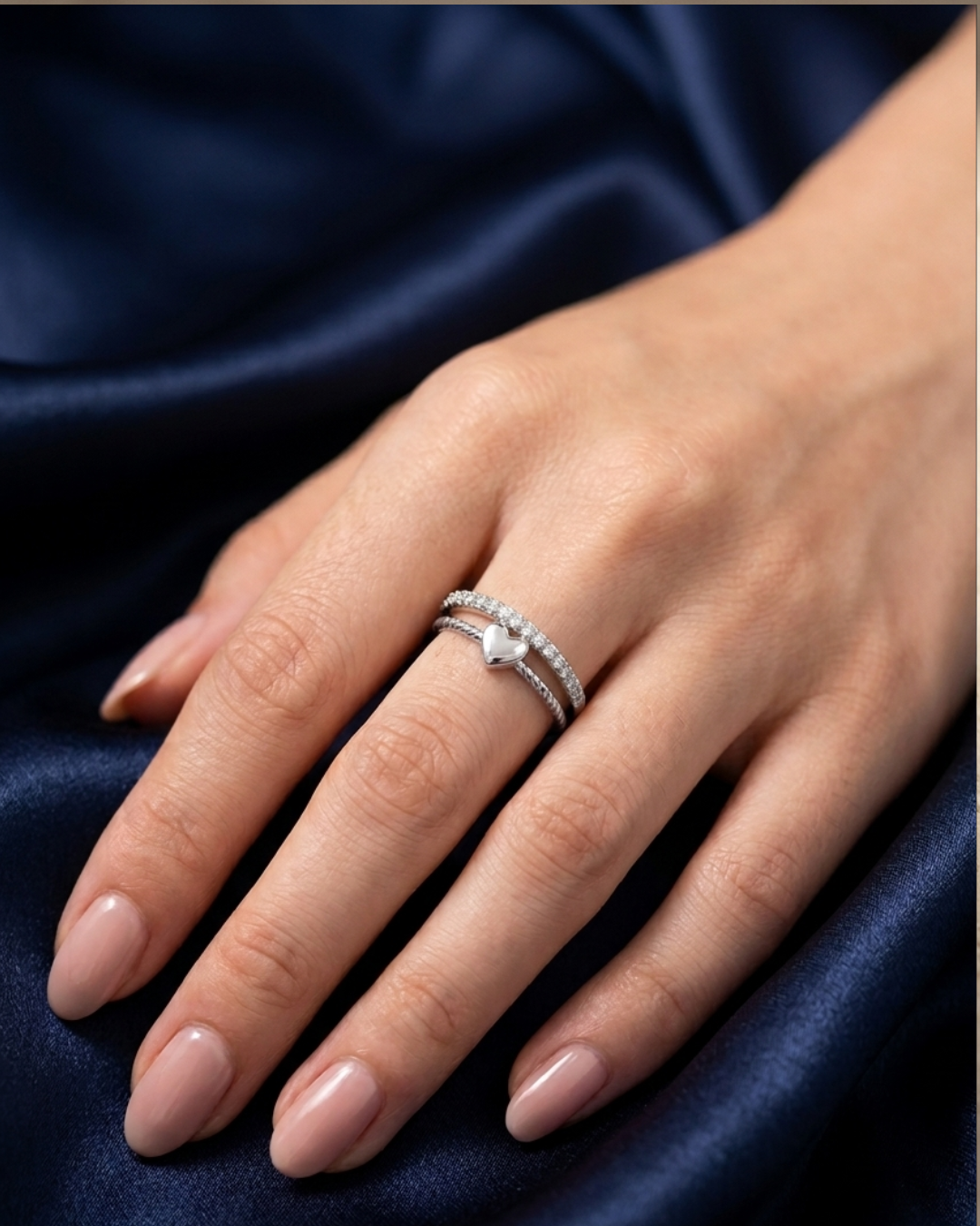 silver-plated adjustable ring with a heart charm and cubic zirconia stones